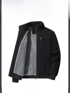 Detail view of men's black winter jacket featuring thick grey sherpa lining and zip pocket