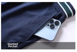 Detail of slanted pockets and striped elastic waistband on casual navy summer shorts