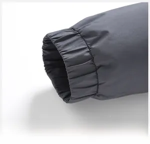 Detail of elastic windproof cuffs on men's down jacket with precise stitching