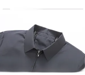Detail of classic polo collar and metal zipper on men's dark grey executive jacket