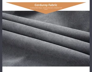 Macro shot of gray corduroy fabric showing thick vertical texture for winter jackets