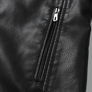 Macro detail of men's leather jacket featuring black lychee texture and silver metal zipper