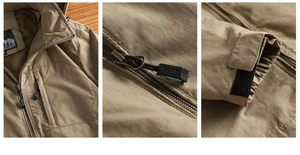 Detail of khaki outdoor jacket showing hooded drawstring and adjustable velcro cuffs