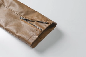 Detailed macro of dark brown PU jacket cuff featuring textured leather and vintage silver zipper