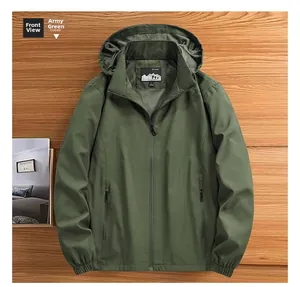 Detail view of army green outdoor hooded jacket with high-quality zipper on wood background