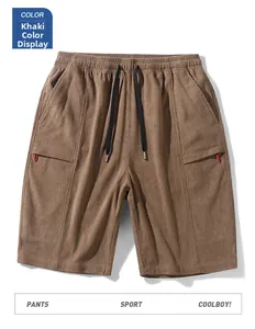 Detail of khaki corduroy shorts showing textured fabric and elastic drawstring waistband