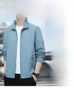 Detail view of men's light blue sun protection jacket featuring elastic cuffs and collar