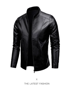 Close-up detail of premium black faux leather jacket showing stitching and sleek texture