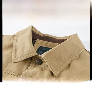 Detail showing the classic khaki turnover collar and premium fabric texture of the jacket