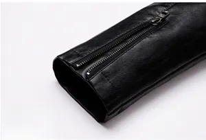 Detailed macro shot of premium black pebble-grain leather cuff with metal zipper