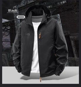 Detail view of water-resistant black outdoor jacket featuring a vertical zipper chest pocket