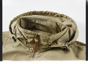 Detail of khaki outdoor jacket showing windproof high collar and breathable mesh lining