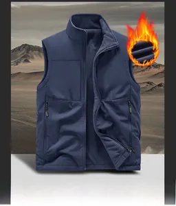 Detail of dark blue outdoor vest featuring thick grey polar fleece lining and zipper pockets
