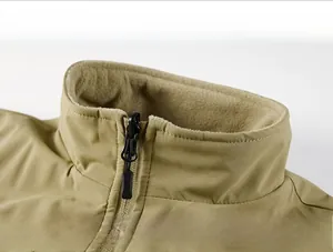 Detail of windproof stand collar with fleece lining and premium black zipper on khaki vest