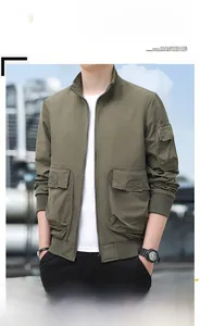 Detail of army green outdoor tactical jacket with utility pockets and standing collar