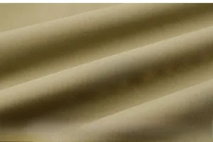 Macro shot of olive green outdoor vest fabric showing fine weave texture and durable quality