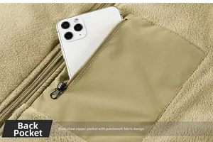 Detail of fleece vest interior zippered pocket showing storage capacity with a phone