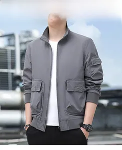 Detail shot of men's utility outdoor jacket showing ribbed cuffs and cargo pockets