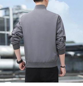 Men's gray bomber jacket with ribbed collar and cuffs, outdoor urban casual back view