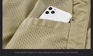 Detail view of khaki jacket interior featuring breathable mesh lining and inner pocket