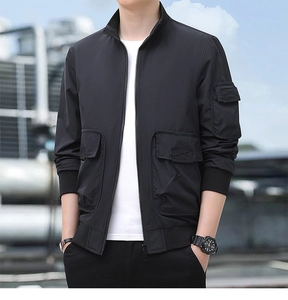 Macro detail of black technical outdoor jacket featuring functional cargo pockets and collar