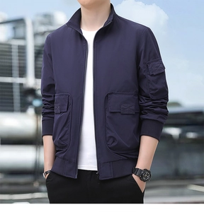 Detail view of navy utility jacket with multiple cargo pockets and ribbed cuffs