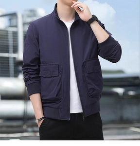 Detail of navy blue tactical jacket with large flap pockets and ribbed cuffs