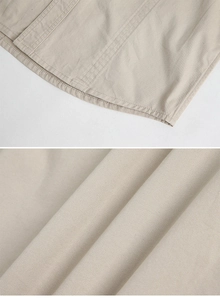 Detailed close-up of durable double-stitched hem and breathable khaki fabric texture