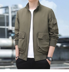 Detail view of army green outdoor utility jacket with functional multi-pockets and ribbed cuffs