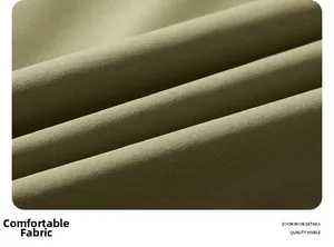 Detailansicht der olivgrünen Softshell-Gewebestruktur und der robusten Nähte