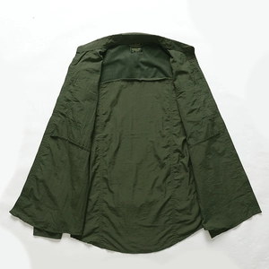 Detail view of military green tactical shirt with breathable mesh lining and brand collar tag