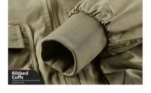 Detail of elastic ribbed cuffs on a men's olive green flight jacket with fine fabric texture
