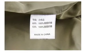 Detailed laundry label of the men's flight jacket showing 100% polyester material info