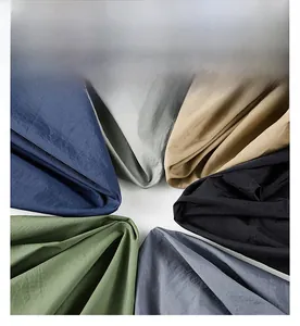 Close-up of lightweight breathable fabric swatches in six functional colors for men
