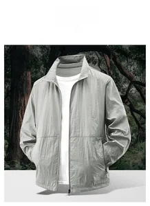 Side view detail of a light gray men's sun protection jacket with high stand collar