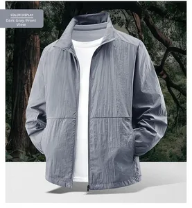 Detail view of dark grey quick-dry sun protection jacket with mock neck for outdoor activities