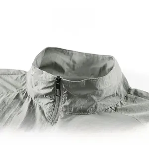 Detailed view of standing collar design on light gray sun protection jacket for men