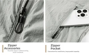Detail of gray sun protection jacket showing zipper head and large side pocket with phone
