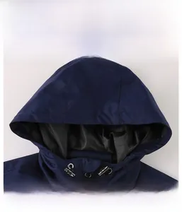 Detail of navy blue hooded jacket with adjustable metal drawstring and black inner lining