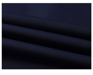 Close-up of durable navy blue waterproof woven fabric texture for outdoor jackets