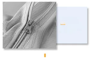 Detail of durable metal zipper and breathable mesh fabric on men's summer utility vest