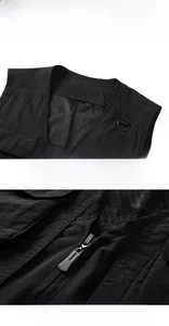 Detail of V-neckline and breathable mesh lining of a black multi-pocket outdoor tactical vest