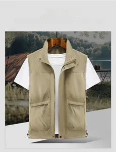 Detail of khaki outdoor utility vest with functional multi-zipper pockets and durable fabric