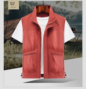 Detail of multi-pocket outdoor vest in brick red with zipper and adjustable drawstring hem