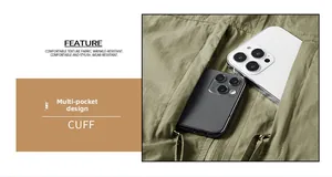 Detail of army green utility vest showing multi-pocket design holding two smartphones