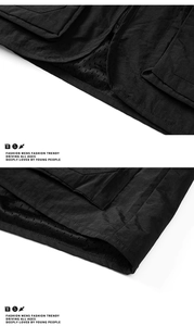 Detail view of black utility vest showing tear-resistant fabric and breathable mesh lining