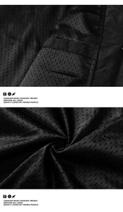 Detail shot of breathable black mesh fabric on the functional multi-pocket vest