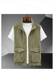 Detailed close-up of khaki multi-pocket utility vest with standing collar and zipper