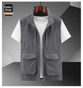 Detail view of a grey outdoor utility vest featuring four functional 3D cargo pockets