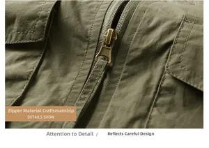 Detail of army green utility vest featuring a smooth metal zipper and reinforced stitching